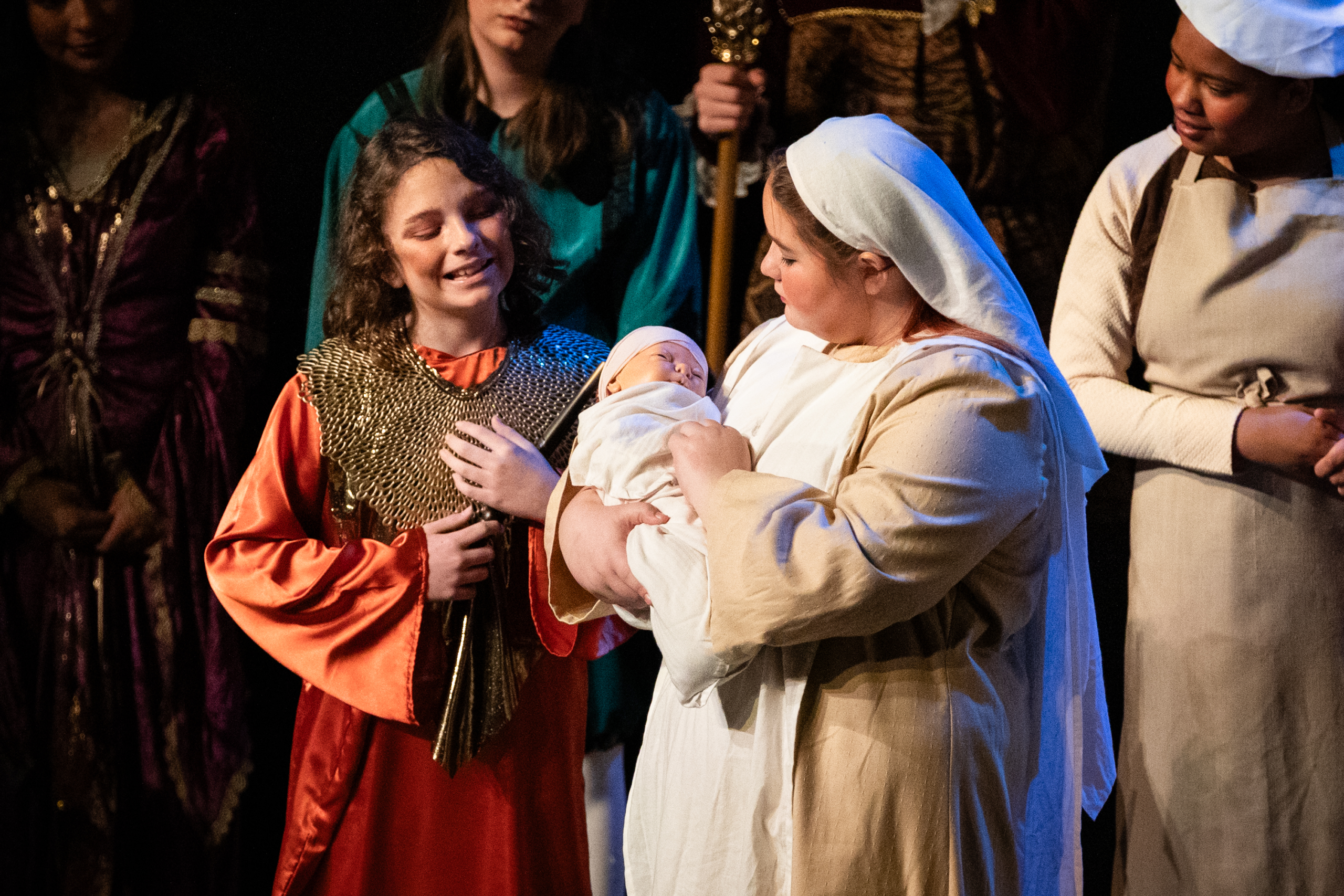 Child exploring theater arts through interest-led unschooling activities.